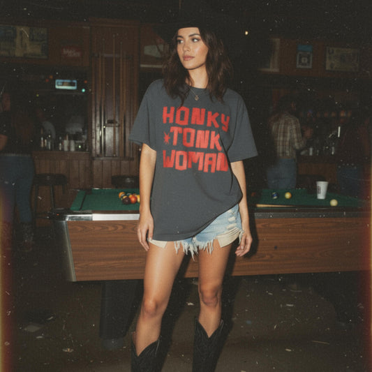 Woman wearing a 'Honky Tonk Woman' t-shirt in a bar setting