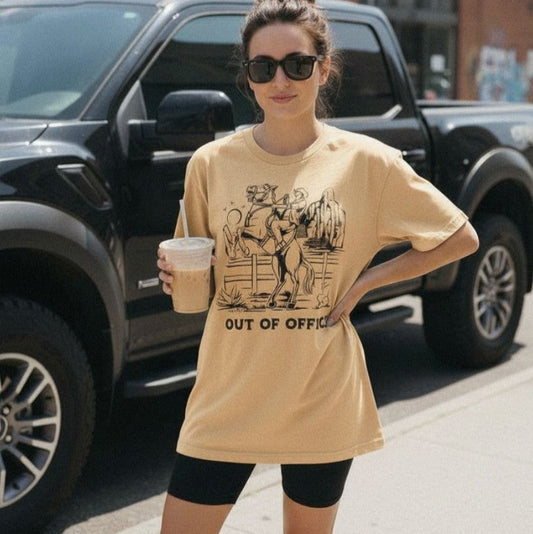 Comfort Colors graphic tee with text 'Out of Office' and cowboy on a bucking horse