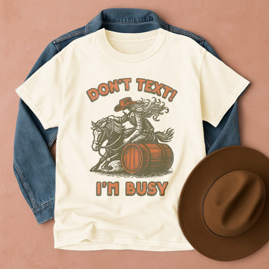 Comfort Colors T-shirt with graphic design featuring a cowgirl on a horse barrel racing, Front view