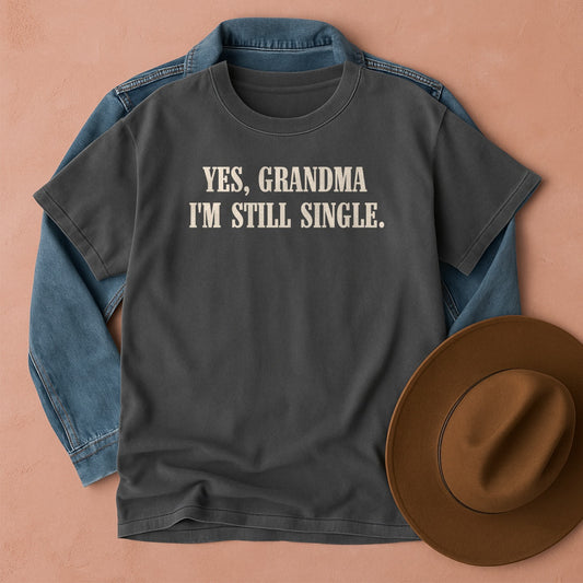 Comfort Colors t-shirt with 'YES, GRANDMA I'M STILL SINGLE' text. Funny Thanksgiving tee.