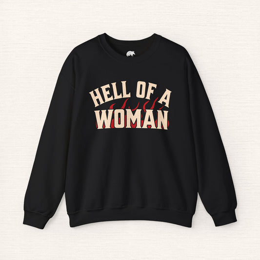 Black sweatshirt with 'HELL OF A WOMAN' text on a white background