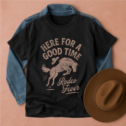 Black t-shirt with 'Here for a Good Time Rodeo Fever' graphic, denim jacket, and brown hat on a beige background