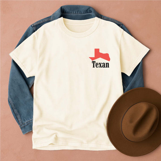 White t-shirt with red and black 'Texan' design, blue denim jacket, and brown hat, front view