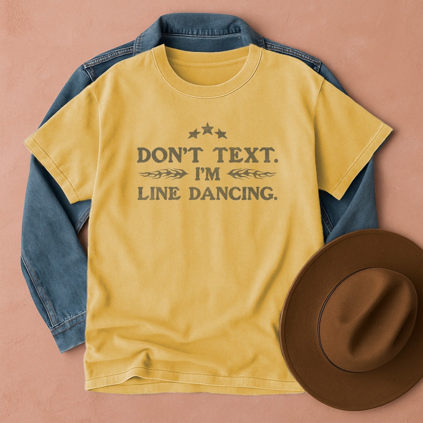 Mustard Yellow t-shirt with Don't Text. I'm Line Dancing text, front view