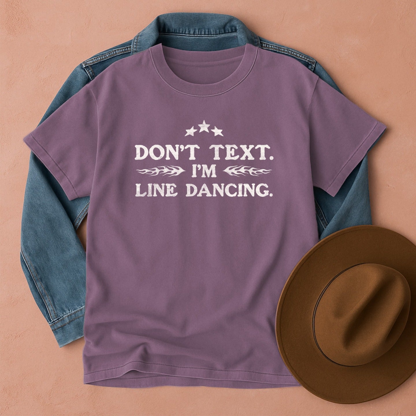Purple t-shirt with 'Don't Text. I'm Line Dancing' text, front view